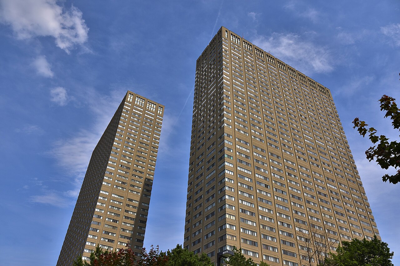 High-rise rental apartment towers in Toronto against a clear sky.